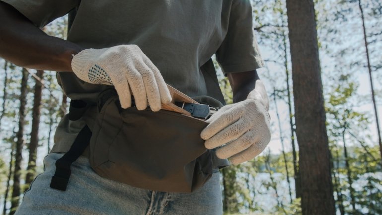 Anti theft travel pouch with lockable zippers and RFID blocking worn discreetly by traveler for secure protection against theft