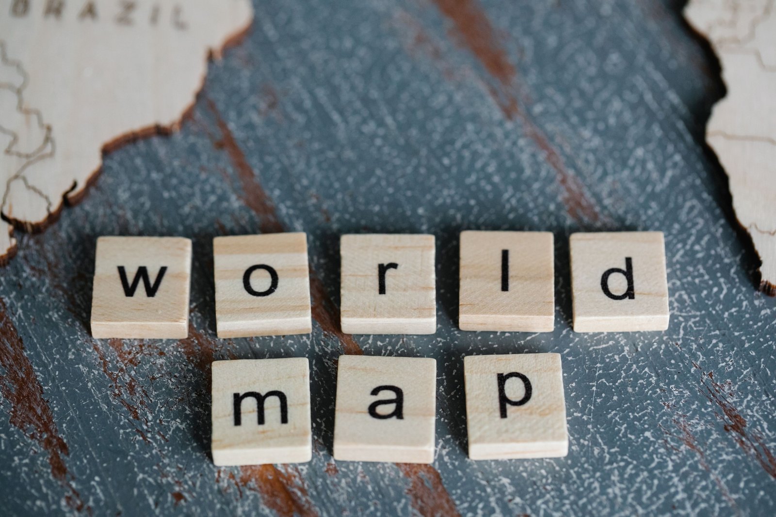 Person learning Spanish travel vocabulary with map and notebook for effective language translation