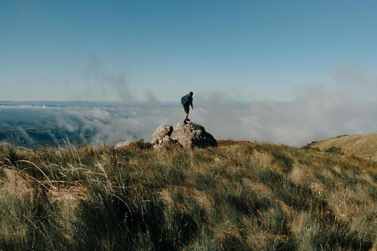 Traveler enjoying breathtaking landscape on an adventurous journey, inspiring wanderlust and cultural exploration