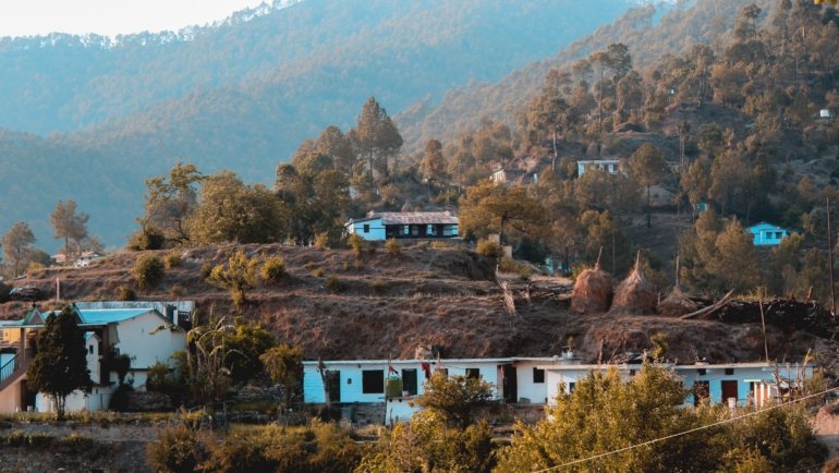peaceful village nestled in lush nature representing mindful and authentic repine travel experience