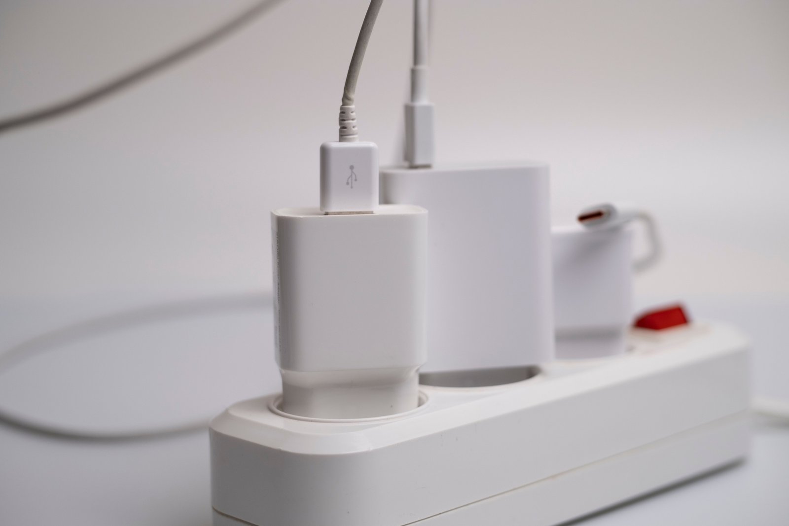 Compact 5 in 1 travel power strip with multiple international outlets and USB ports for charging devices while traveling