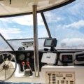 Sailboat cockpit equipped with a dodger and bimini providing sun and weather protection