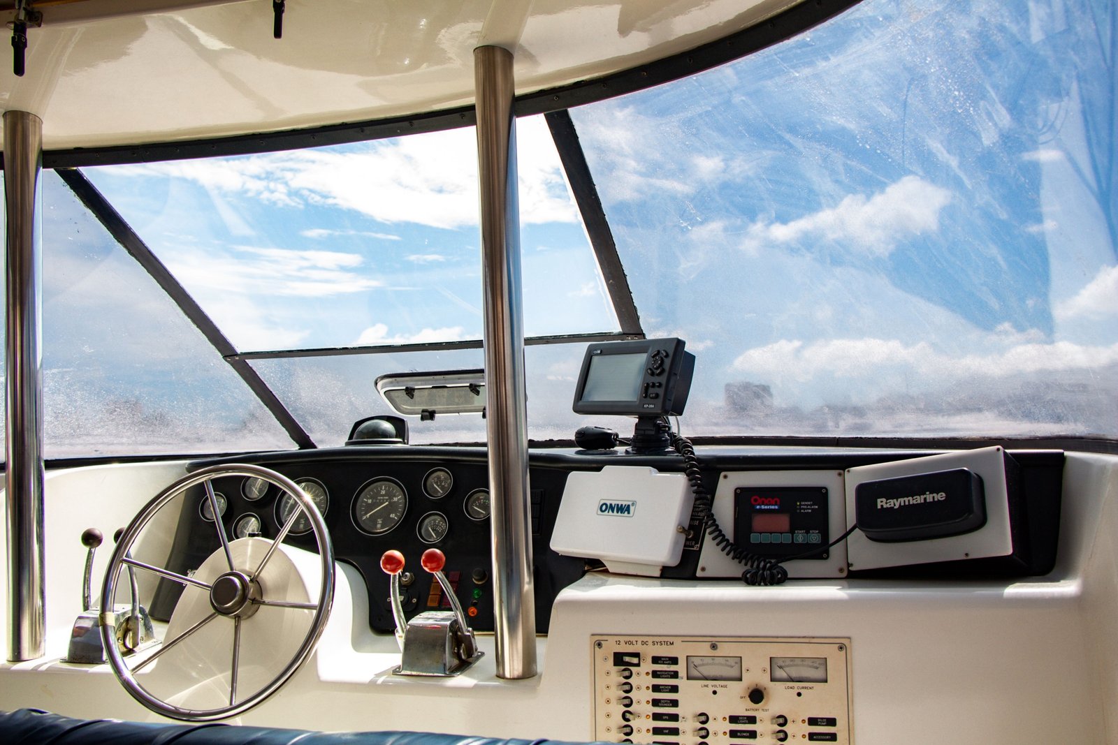 Sailboat cockpit equipped with a dodger and bimini providing sun and weather protection