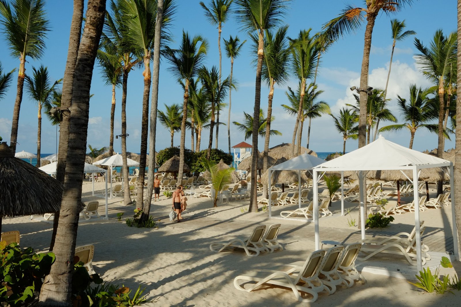 Traveler relaxing on a Dominican Republic beach with travel insurance protection for medical emergencies and trip cancellations