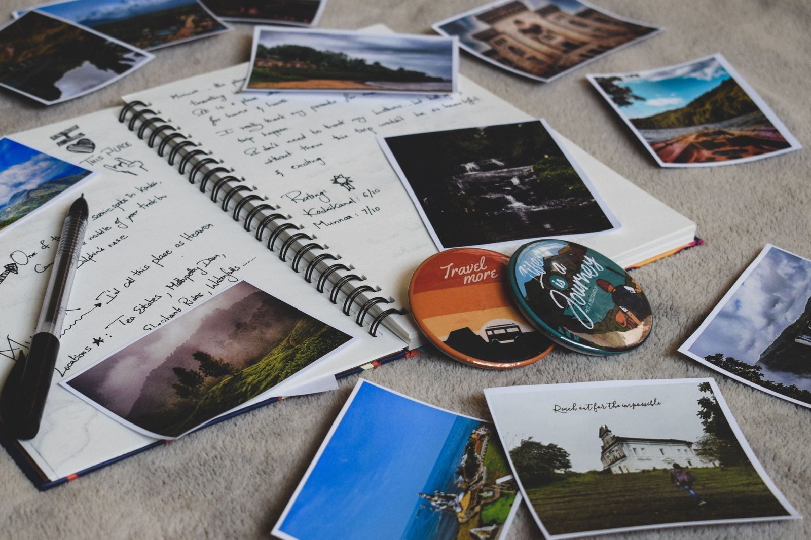 Open personalized travel journal with handwritten notes, sketches, and travel keepsakes documenting memorable adventures