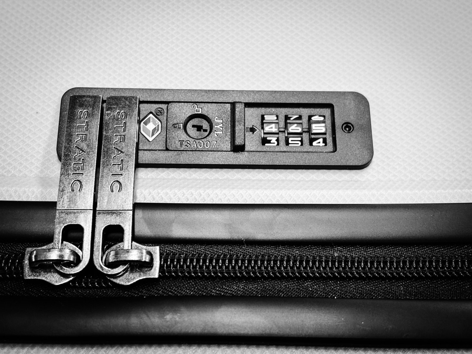TSA-approved travel luggage lock securing suitcase zipper for safe and secure travel