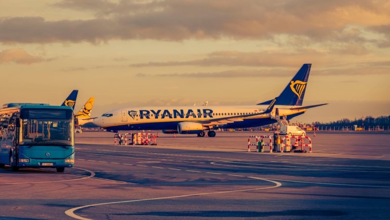 Secure airport parking lot with shuttle service transporting travelers to terminal