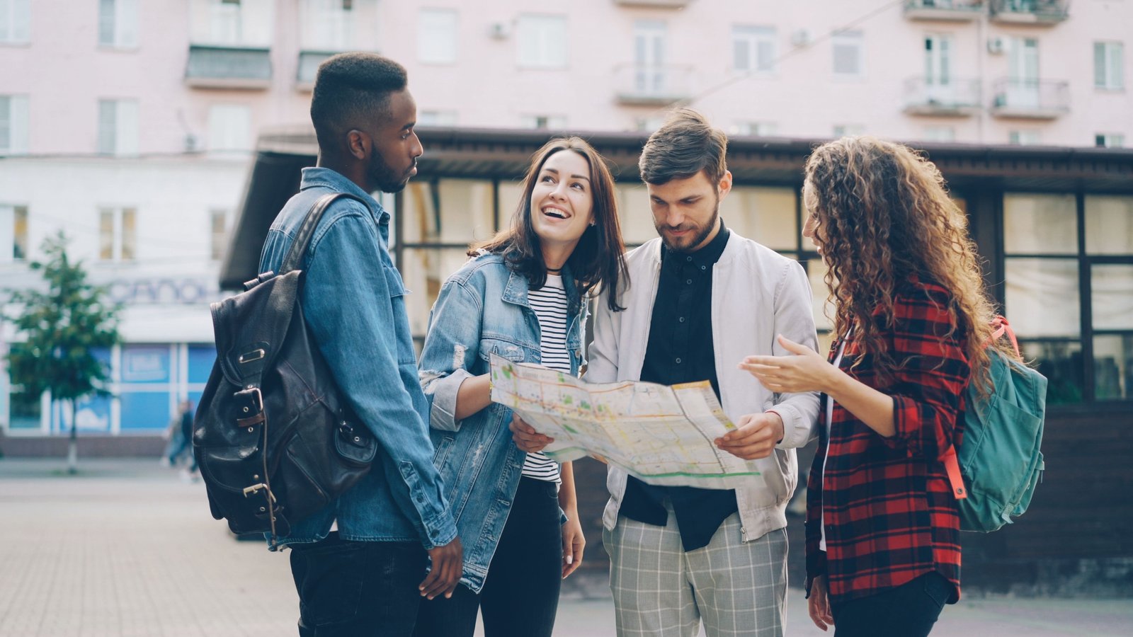 Traveler planning trip with map and Seattle skyline showing Space Needle and waterfront