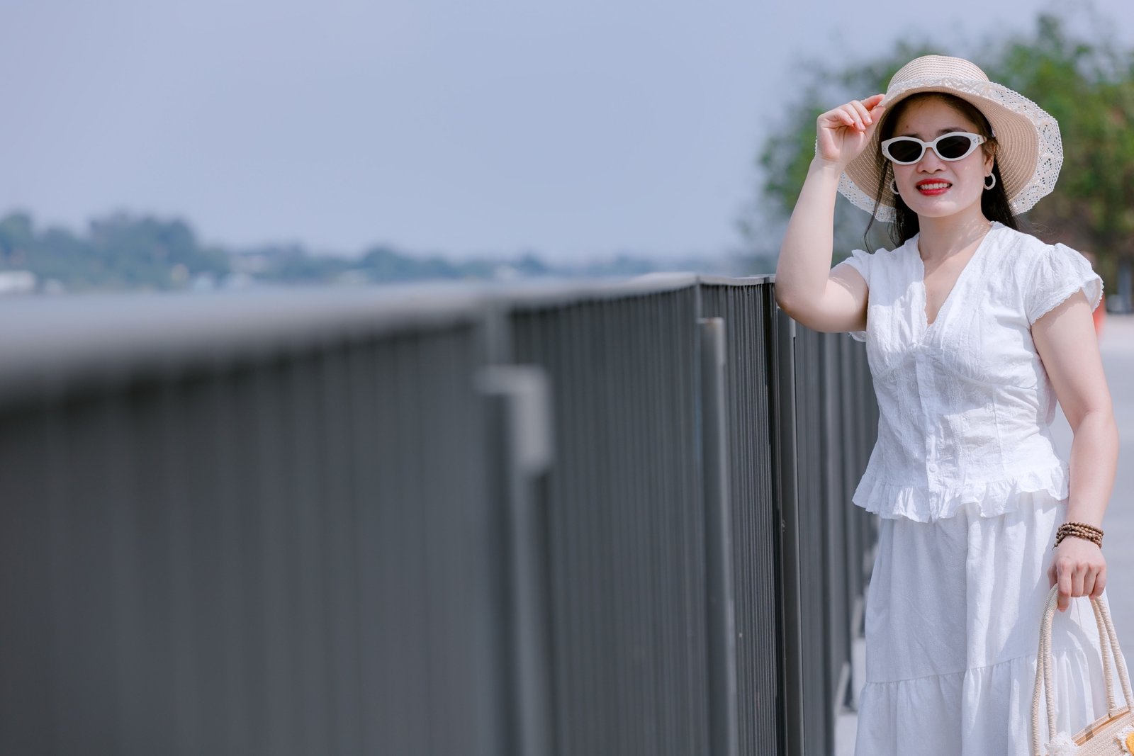 Petite woman dressed in stylish, well-fitting travel outfit with layers, ready for travel and comfortable on the go