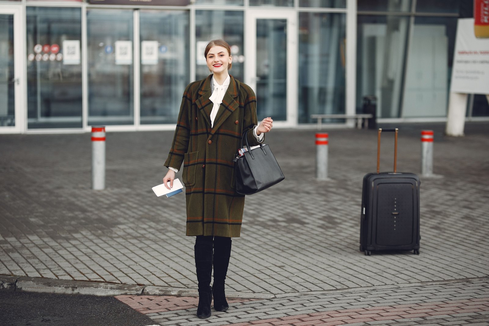 Stylish traveler with durable luggage and travel accessories ready for adventure