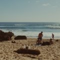 Sunny tropical beach in January with clear blue sky and gentle waves, ideal winter vacation destination