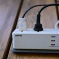 5 in 1 travel power strip charging multiple devices including smartphones and laptops during travel