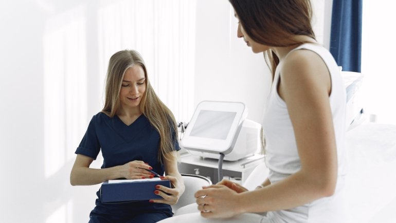 Travel licensed practical nurse providing care to a patient in a healthcare facility