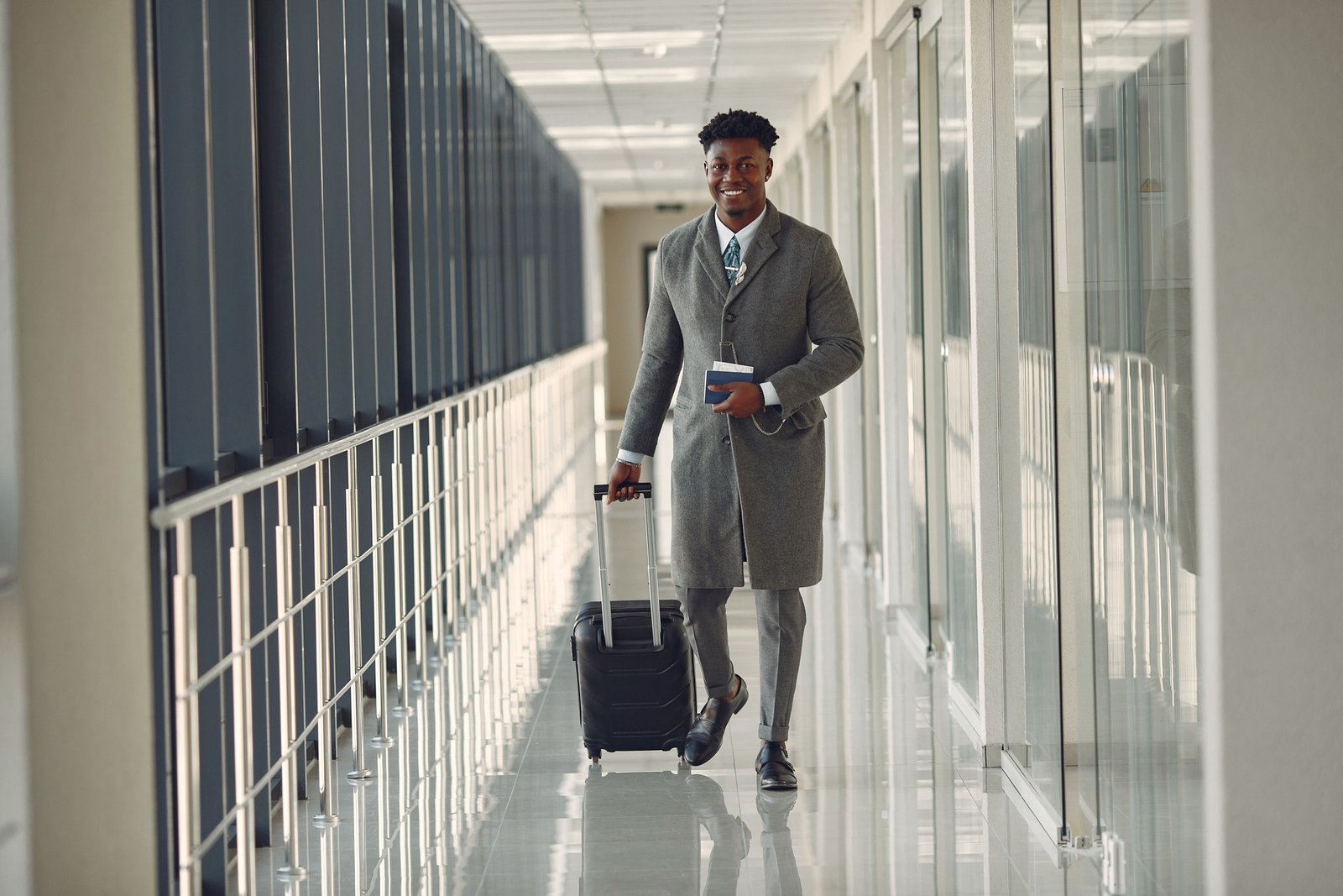 Business traveler with stylish carry on luggage navigating airport terminal for efficient and organized travel