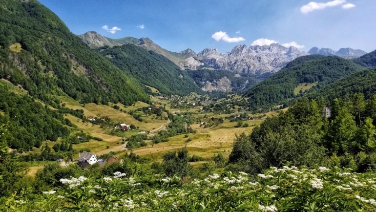 Scenic landscape and cultural landmarks of the Balkans showcasing historic towns, mountains, and vibrant local life