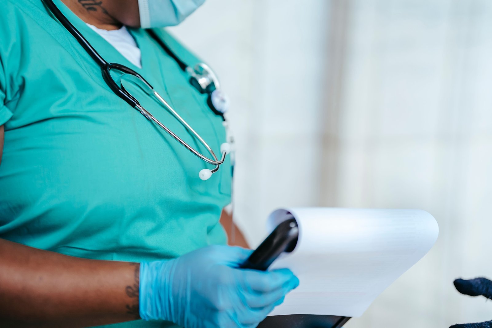 Travel nurse in scrubs enjoying Montana's scenic landscape combining healthcare profession and outdoor adventure