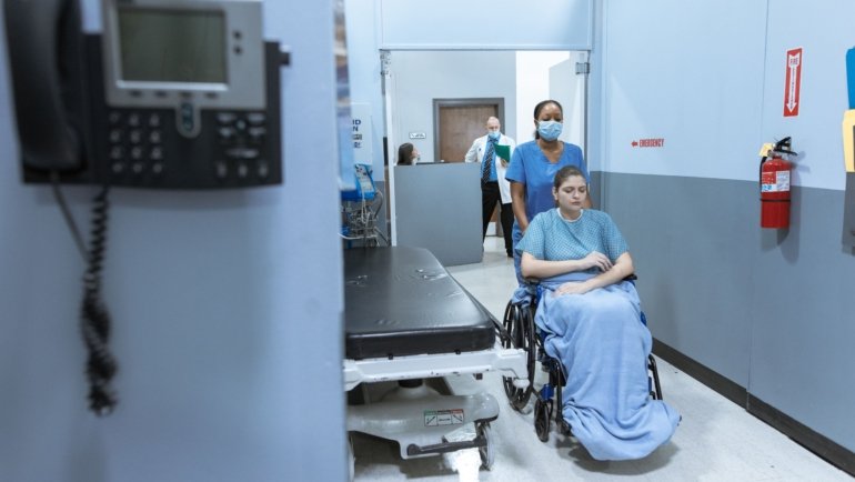 Travel certified nursing assistant providing patient care in a Georgia healthcare facility, representing flexible travel CNA jobs