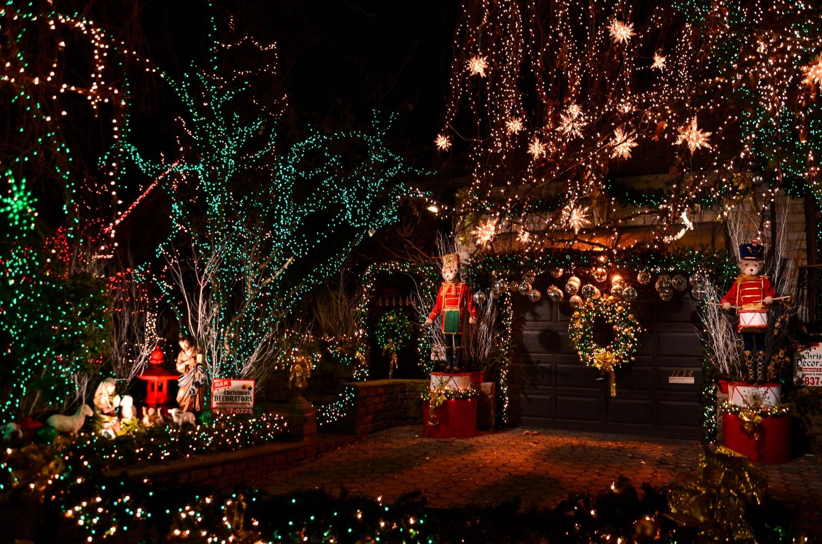 New York City street decorated with Christmas lights and festive holiday decorations at night