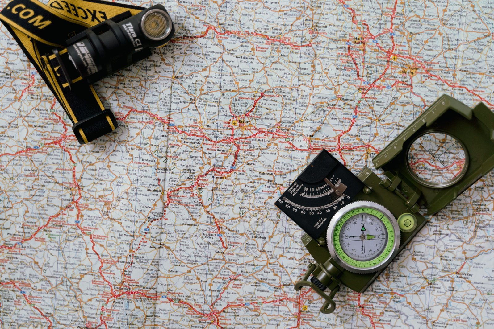 Close-up of a hands holding an RV travel map with marked routes and campgrounds for an adventurous road trip