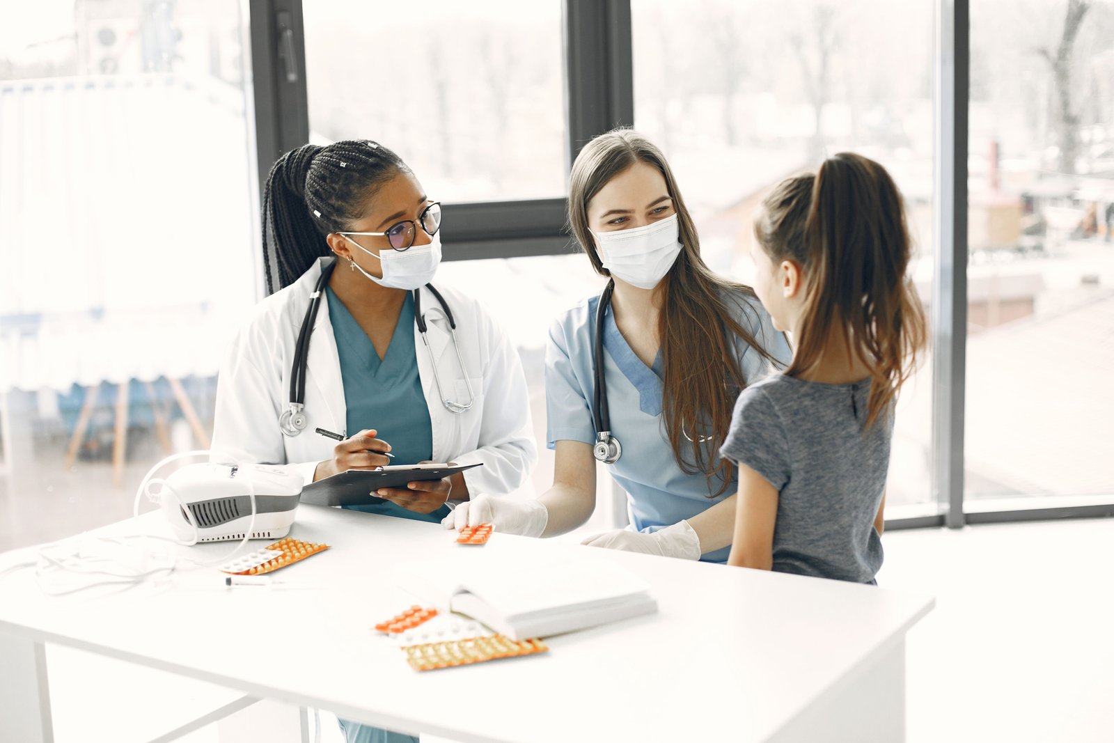 Pediatric intensive care nurse providing critical care to a young patient in a hospital intensive care unit