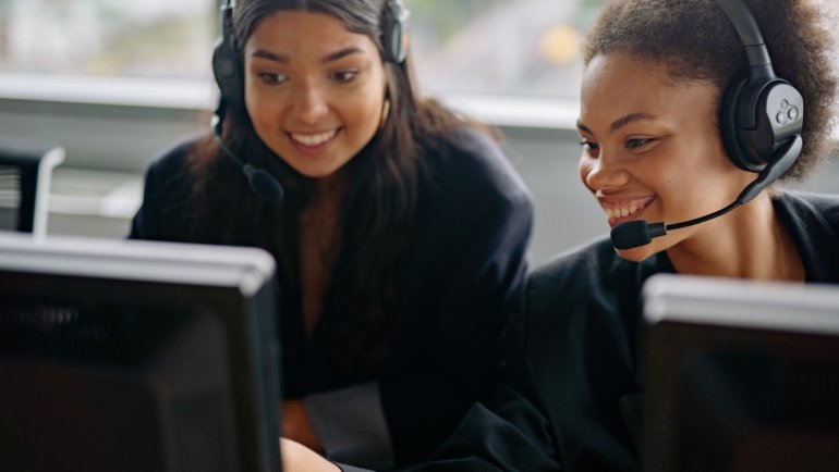 Travel agent helping clients plan personalized vacation with expert advice and travel documents