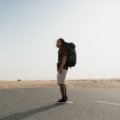 Traveler wearing Royal Robbins Active Traveler Zip N Go pants with legs zipped off hiking outdoors