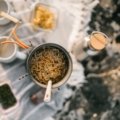 Portable travel spice containers with fresh ingredients and camping cooking setup for flavorful meals on the go